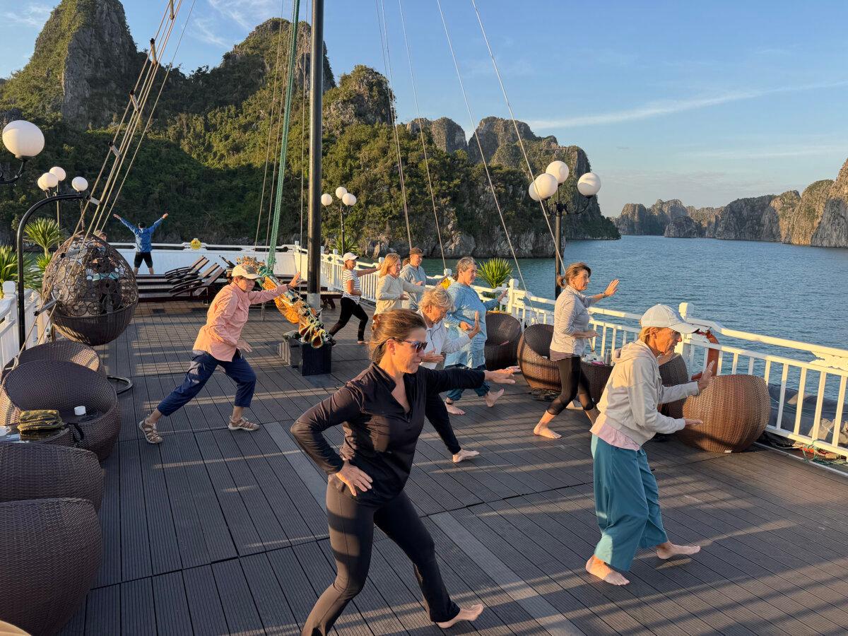 Morning tai chi as we cruised Bai Tu Long Bay on our private boat. (Lori Rackl/TNS)