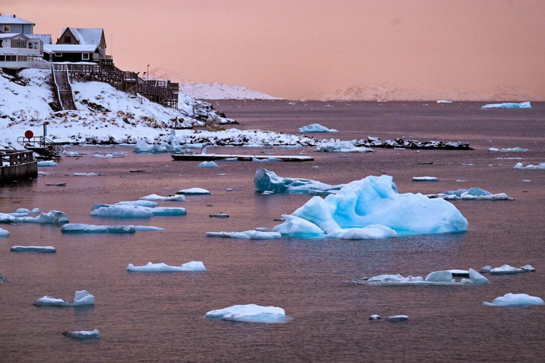 Floating ice is seen at the coastline of the city in Nuuk, western Greenland, on February 4, 2026. (Photo by Ina FASSBENDER / AFP via Getty Images)