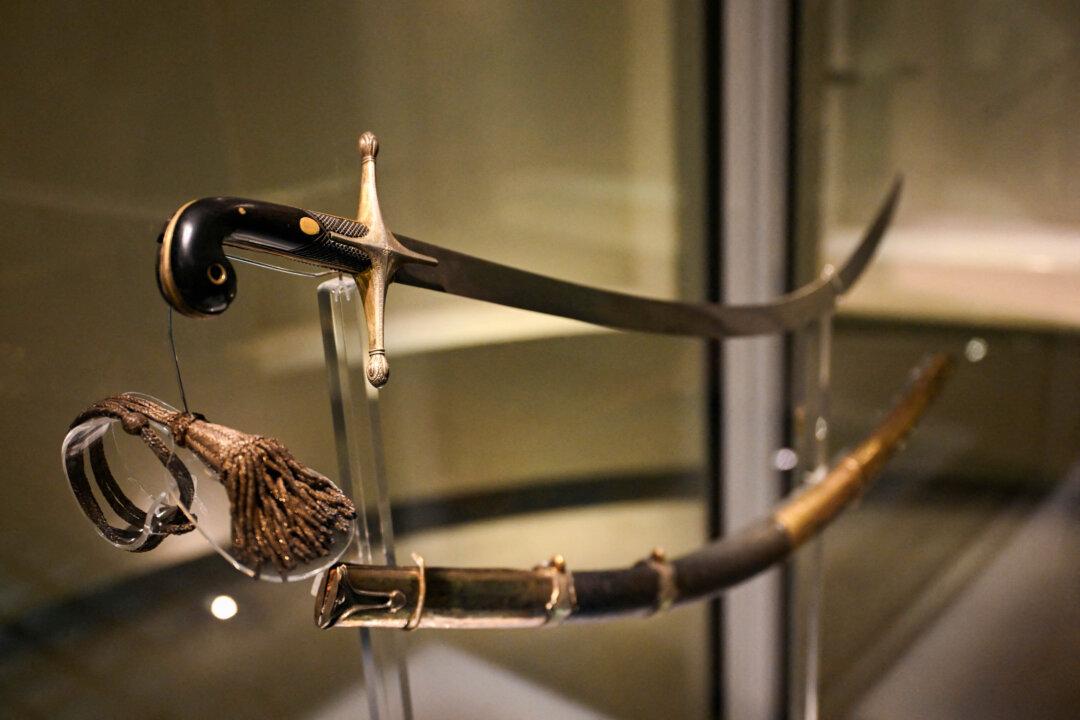 The curved saber that belonged to Argentine national hero General Jose de San Martin is pictured at the National Historical Museum in Buenos Aires on February 4, 2026. The decision by Javier Milei's government to move the saber of Argentine Liberator Jose de San Martin to a military regiment sparked indignation among the heirs of the piece, who demanded in court that the weapon remain in the National Historical Museum, where it was donated in 1897. (Photo by Luis ROBAYO / AFP via Getty Images)