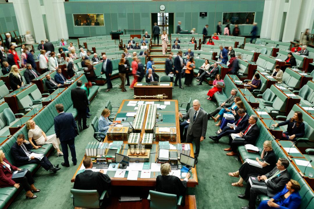 CANBERRA, AUSTRALIA - FEBRUARY 04: Members move across the floor during a division in the House of Representatives at Parliament House on February 04, 2026 in Canberra, Australia. Sessions resumed at parliament with a strong focus on the Liberal, National and One Nation parties as the former coalition loses substantial support and is embroiled in leadership turmoil. (Photo by Hilary Wardhaugh/Getty Images)