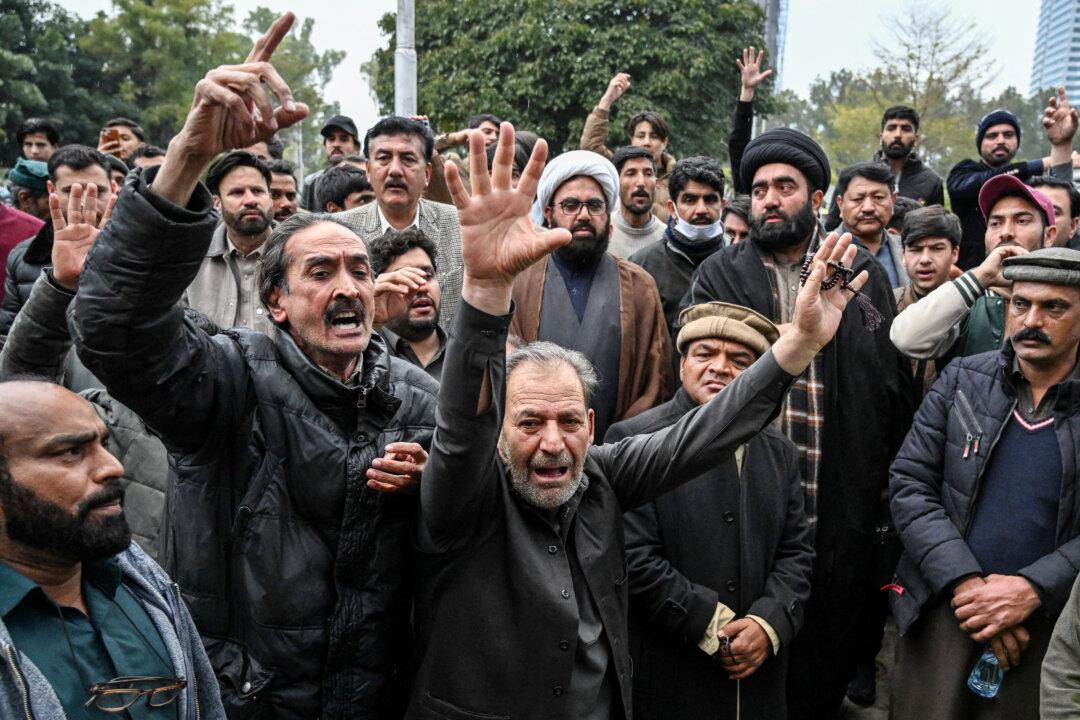 Shiite Muslims shout anti-government slogans outside a hospital following a suicide bombing at a Shiite mosque in Islamabad on February 6, 2026. A suicide bombing at a Shiite mosque in Pakistan's capital Islamabad killed at least 31 people on February 6, local authorities said, with a police source saying more than 130 were wounded. (Photo by Aamir QURESHI / AFP via Getty Images)