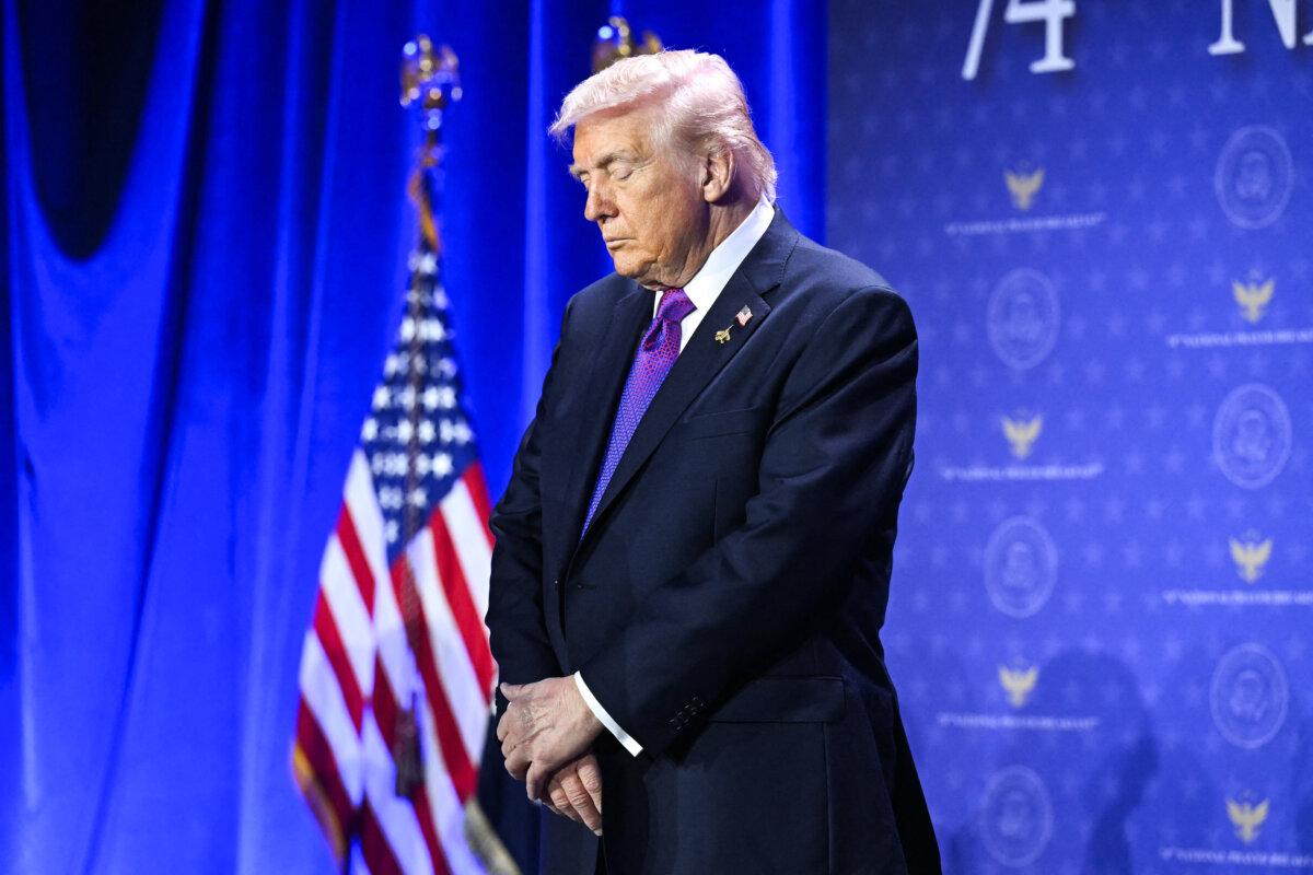 President Donald Trump bows his head during the National Prayer Breakfast at the Washington Hilton in Washington on Feb. 5, 2026. (Saul Loeb / AFP via Getty Images)