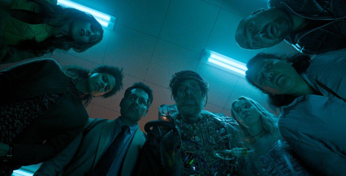 (L–R) Ingrid (Haley Lu Richardson), Janet (Zazie Beetz), Mark (Michael Peña), Future Man (Sam Rockwell), Susan (Juno Temple), Jillian (Anna Acton), and Scott (Asim Chaudhry), in “Good Luck, Have Fun, Don’t Die.” (Briarcliff Entertainment)