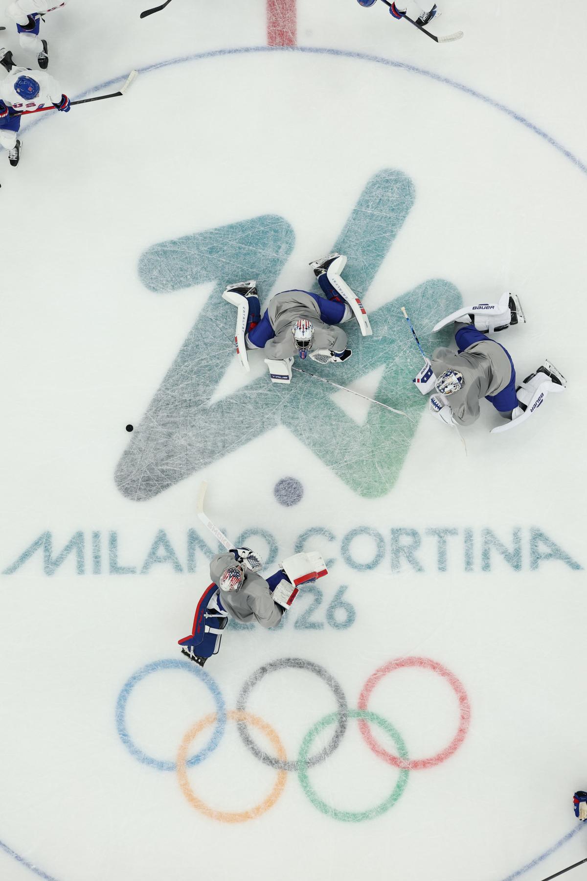Goaltenders Conner Hellebuyck #37, Jake Oettinger #30, and Jeremy Swayman #1 of Team United States take part during training on day 2 of the Milano Cortina 2026 Winter Olympic games at Milano Santagiulia Ice Hockey Arena in Milan on Feb. 8, 2026. (Gregory Shamus/Getty Images)