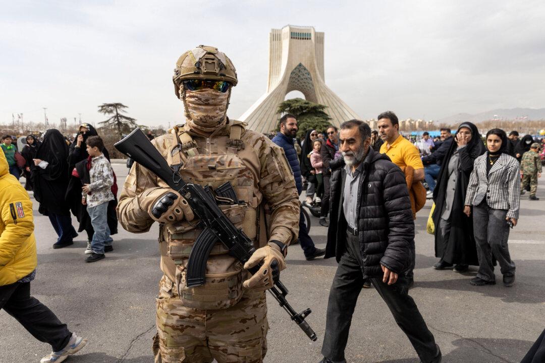 TEHRAN, IRAN - FEBRUARY 11: An Iranian special forces agent patrols during commemorations to mark the anniversary of the 1979 Iranian Revolution on February 11, 2026 in Tehran, Iran. In that year, Ruhollah Khomeini led an overthrow of the Pahlavi dynasty in 1979 and established himself as Supreme Leader of the Islamic Republic of Iran. (Photo by Majid Saeedi/Getty Images)