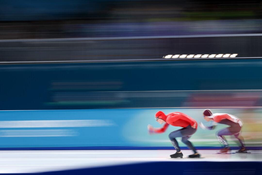 MILAN, ITALY - FEBRUARY 11: Bjorn Magnussen of Team Norway and Kyung-Min Koo of Team Republic of Korea compete during the Speed Skating Men's 1000m on day five of the Milano Cortina 2026 Winter Olympic games at Milano Speed Skating Stadium on February 11, 2026 in Milan, Italy. (Photo by Dean Mouhtaropoulos/Getty Images)