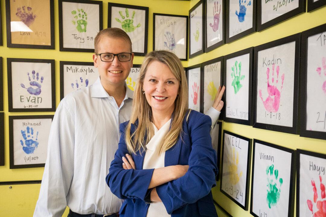 Jennifer Larson, founder and CEO of the Holland Center, and her son Caden Larson in Minnetonka, Minn., on Feb. 11, 2026. Larson built the center for her autistic, non-speaking son, who is now 25 years old. (Adam Hester for The Epoch Times)