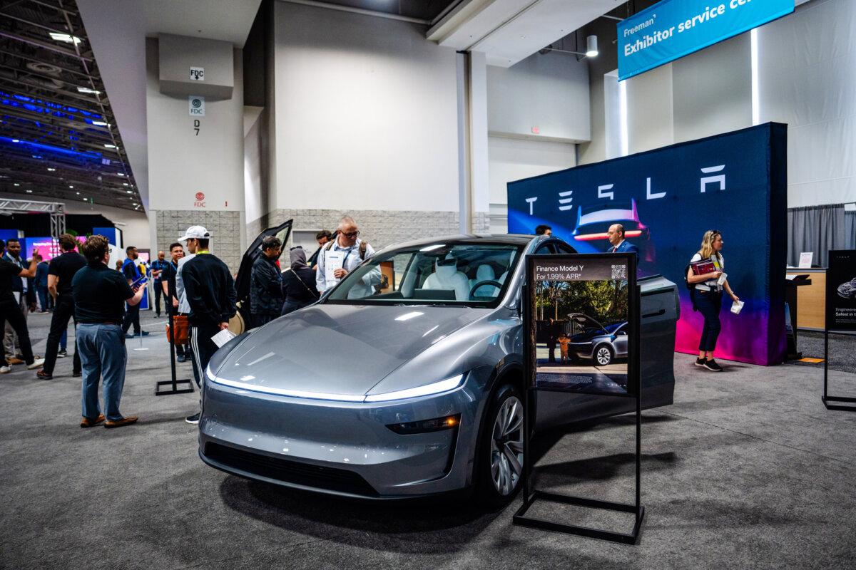 A Tesla Model Y is displayed at the AI+Expo Special Competitive Studies Project in Washington on June 2, 2025. (Madalina Vasiliu/The Epoch Times)