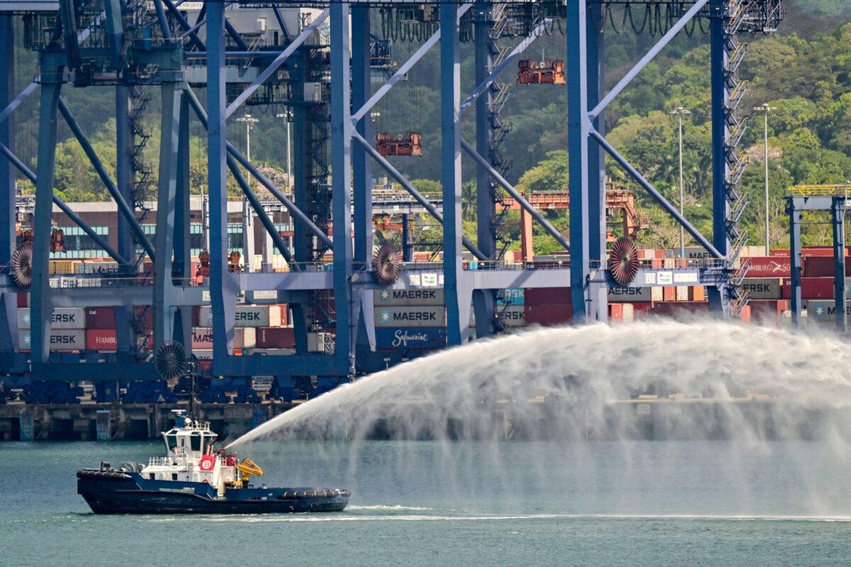 A tug boat sprays water at the port of Balboa in Panama City on Feb. 12, 2026. (Martin Bernetti/AFP via Getty Images)