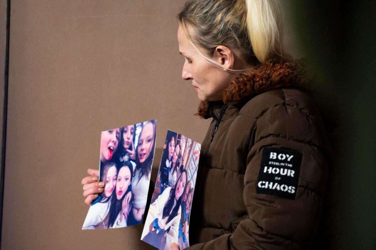 Sarah Lampert shows photos of her daughter Ticaria Lampert, who was killed in the Tumbler Ridge Feb. 10 shooting, in Tumbler Ridge, B.C, on Feb. 12, 2026. (Paige Taylor White / AFP via Getty Images)