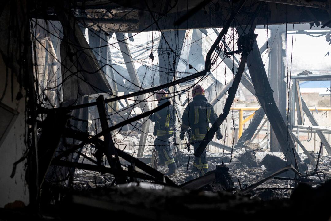 Ukraine's State Emergency Service rescuers walk through the rubble of a heavily damaged building at the site of a Russian attack in Odesa on February 13, 2026, amid the Russian invasion of Ukraine. Six people died in Russian strikes across Ukraine overnight that targeted the southern port city of Odesa and energy infrastructure, officials announced on February 13, 2026. Moscow has stepped up its attacks on Ukrainian critical infrastructure in recent weeks despite pressure by the United States to reach a peace deal with Kyiv. Russia launched one missile and 154 drones overnight, the Ukrainian air force said, warning that some unmanned aerial vehicles were still in Ukrainian airspace as of the morning of February 13, 2026. (Photo by Oleksandr GIMANOV / AFP via Getty Images)