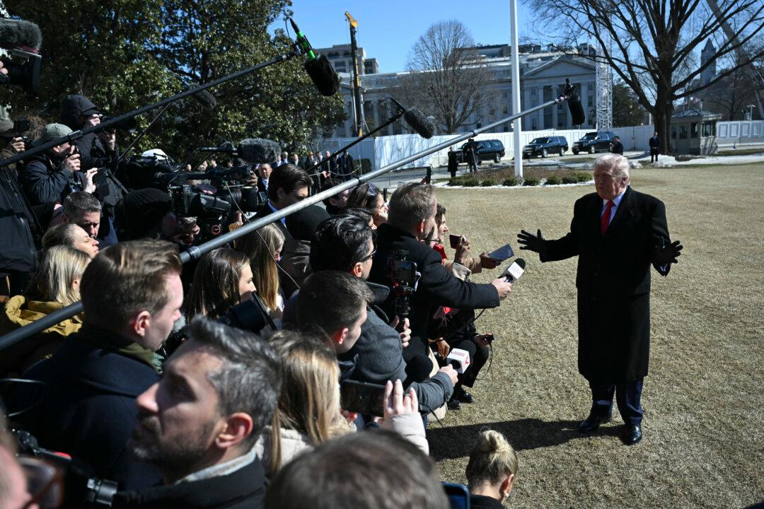 US President Donald Trump speaks to the media as he walks to board Marine One prior to departure from the South Lawn of the White House in Washington, DC, on February 13, 2026. (Photo by ANDREW CABALLERO-REYNOLDS / AFP via Getty Images)