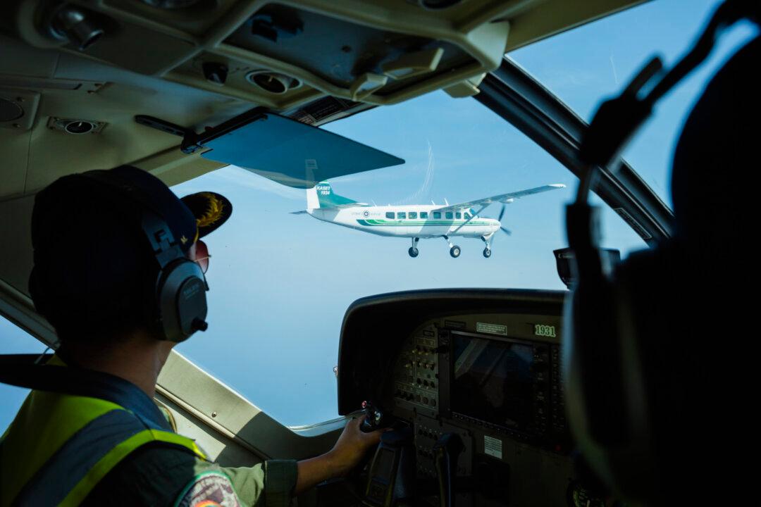 HUA HIN, THAILAND - FEBRUARY 13: AR23, a chemical mix, is dispensed through a pipe at the bottom of a small aircraft while in flight to help cloud seed as seen from the cockpit on February 13, 2026 in Hua Hin, Thailand. Thailand’s Royal Rainmakers take to the skies in a bid to release Bangkok from a toxic chokehold. As air pollution levels in Bangkok continue to reach toxic levels at the start of each year, pollution pilots and ground staff dispense a mixture of sodium chloride and calcium chloride called AR23, as well as dry ice, in an attempt to create artificial rain or increase atmospheric air circulation to help clear the air on the ground.
