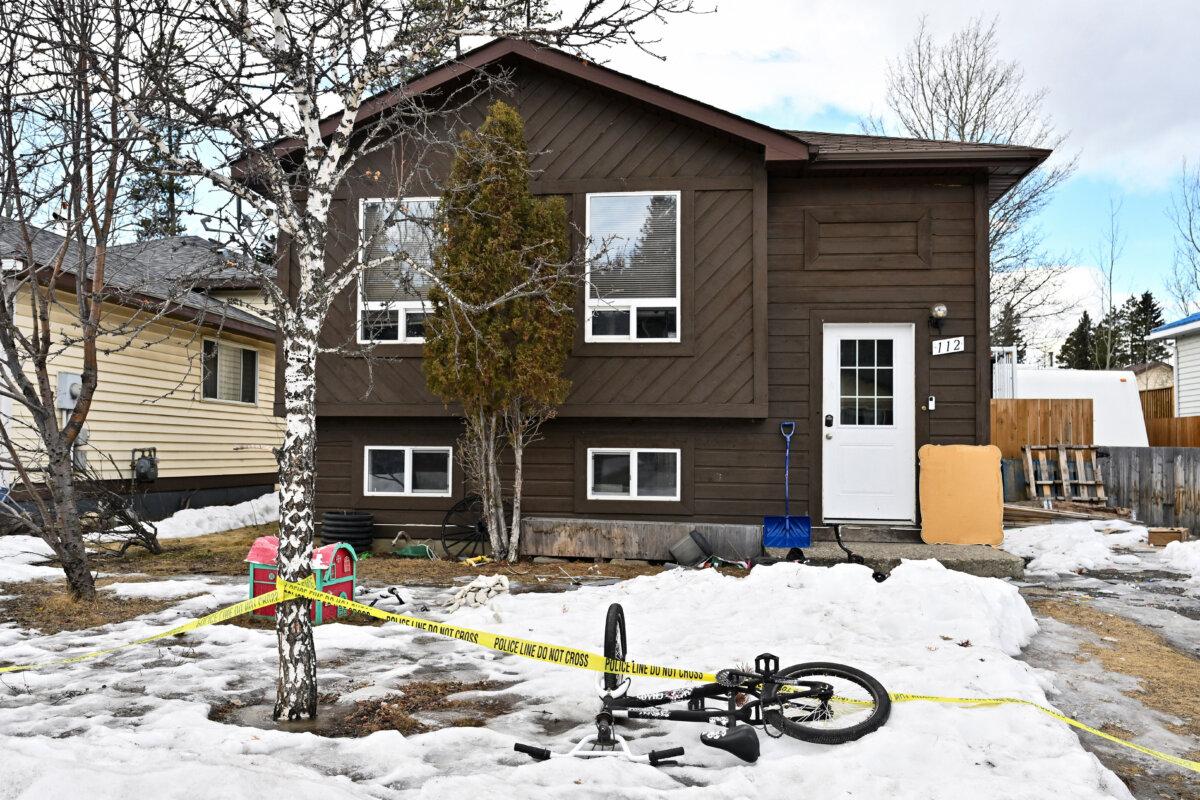 Police tape surrounds what would be the house of the suspect in a mass shooting at a high school, in the town of Tumbler Ridge, B.C., on Feb. 11, 2026. (Reuters/Jennifer Gauthier)