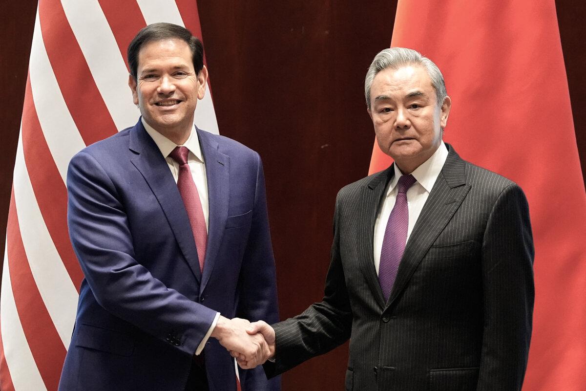 U.S. Secretary of State Marco Rubio shakes hands with Chinese Foreign Minister Wang Yi on the sidelines of the Munich Security Conference in Munich, Germany, on Feb. 13, 2026. (Alex Brandon, Pool/AP)