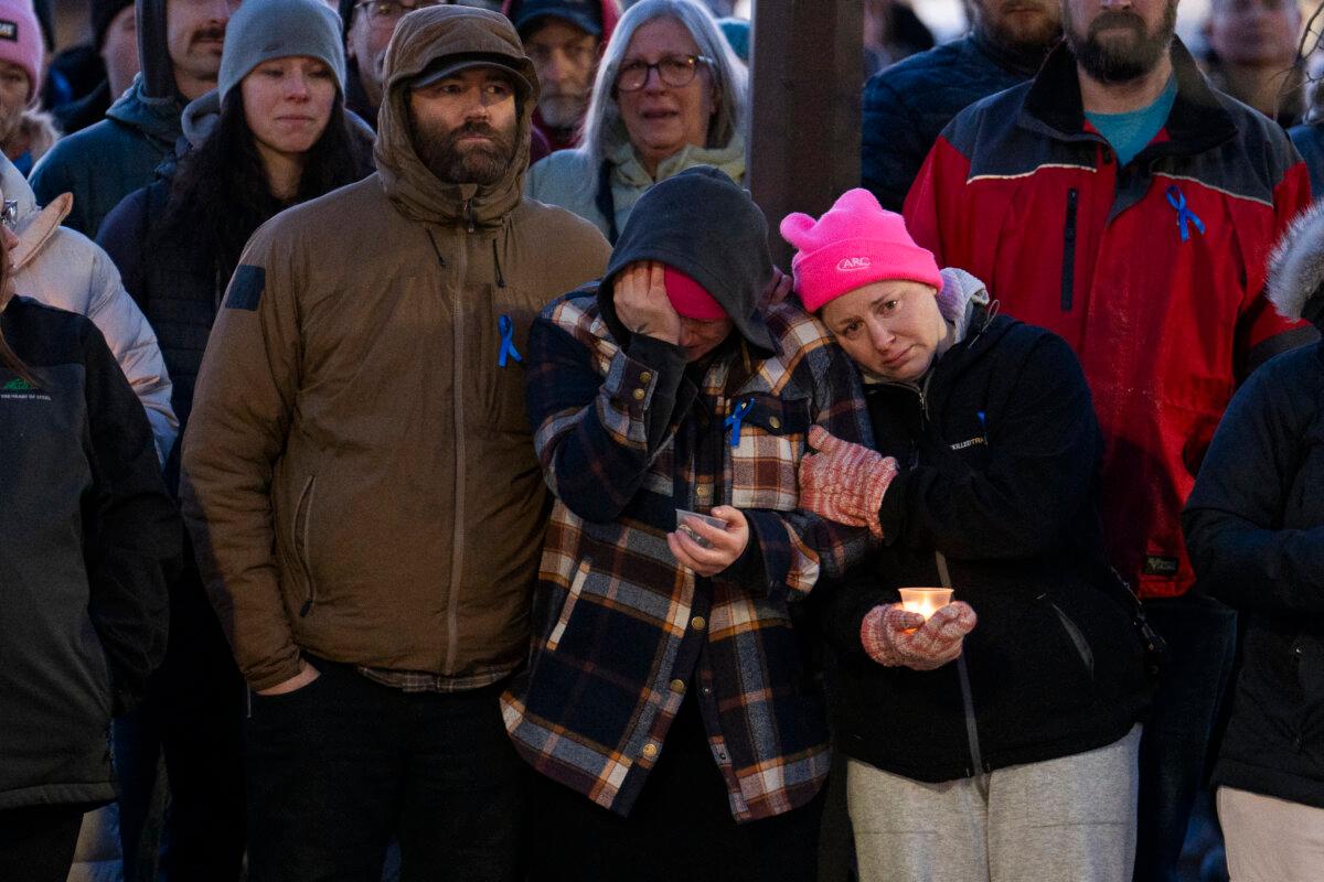 People gather for a vigil after the community experienced one of Canada's deadliest school shootings in Tumbler Ridge, B.C., on Feb. 13, 2026. (Paige Taylor White/AFP via Getty Images)
