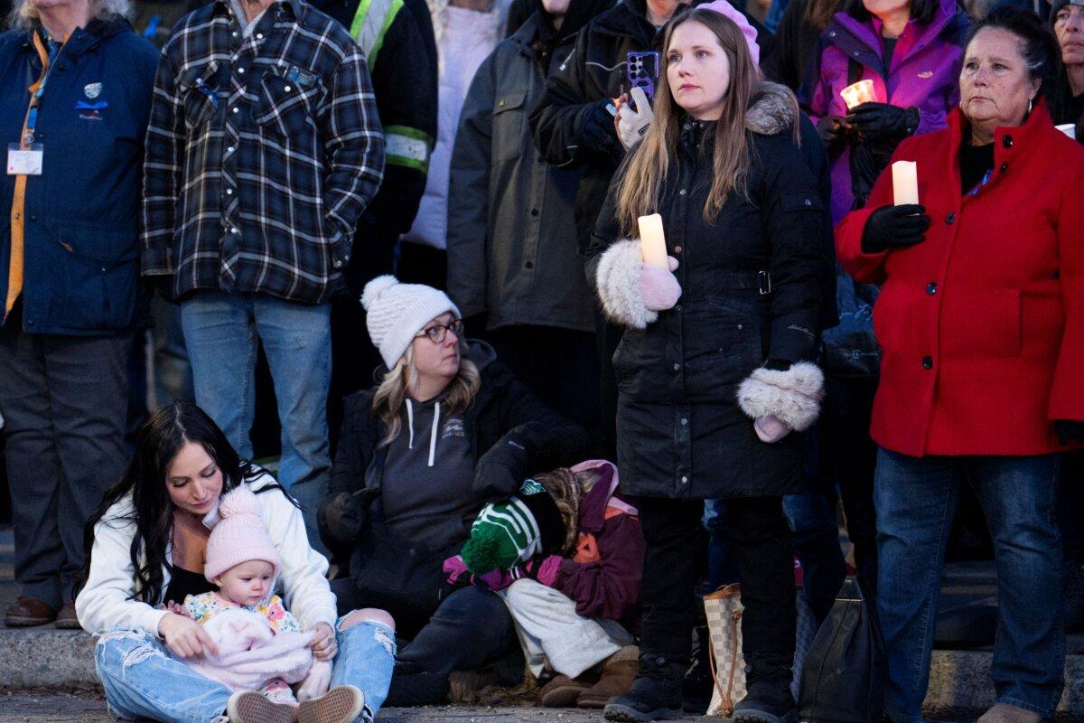 People gather for a vigil after the community experienced one of Canada's deadliest school shootings in Tumbler Ridge, B.C., on Feb. 13, 2026. (Paige Taylor White/AFP via Getty Images)