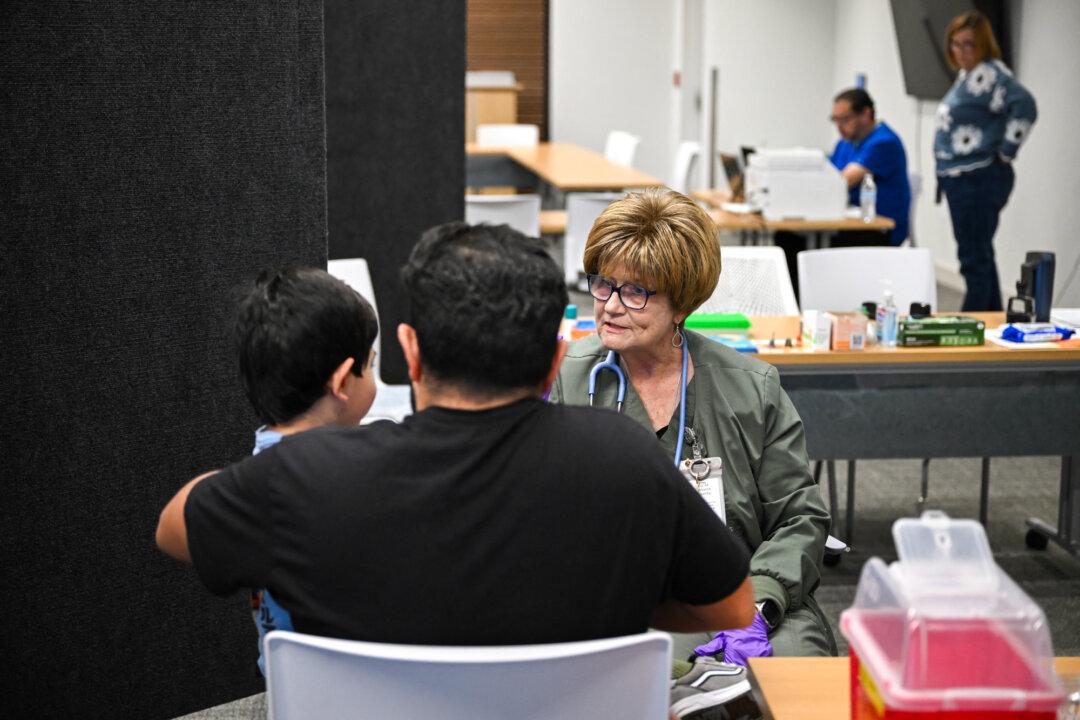 A medical professional prepares to administer a dose of the measles vaccine to a child at a health center in Lubbock, Texas, on Feb. 27, 2025. Legislators in about a dozen states this year have released bills that would alter or ban mandates for vaccines or other medical procedures. (Ronaldo Schemidt/AFP via Getty Images)