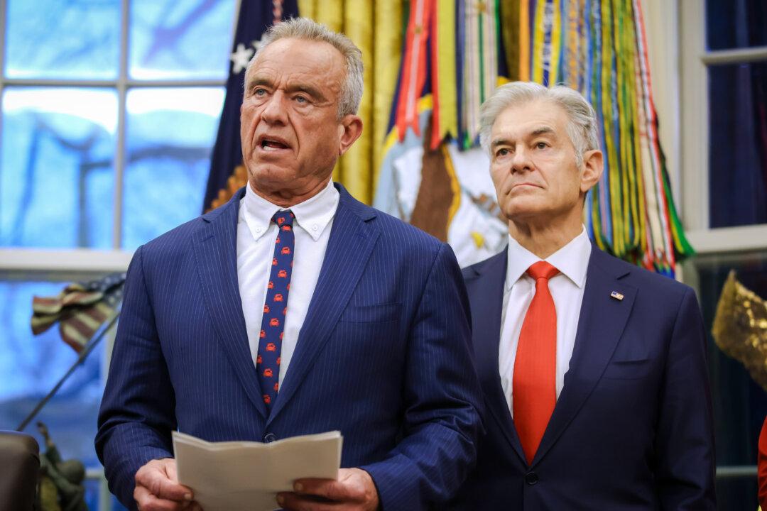 Health Secretary Robert F. Kennedy Jr. (L) speaks in the Oval Office on Jan. 29, 2026. A new coalition composed of 15 groups, including an organization founded by Kennedy, is taking aim at vaccine and mask mandates across the United States. (Samuel Corum/Getty Images)