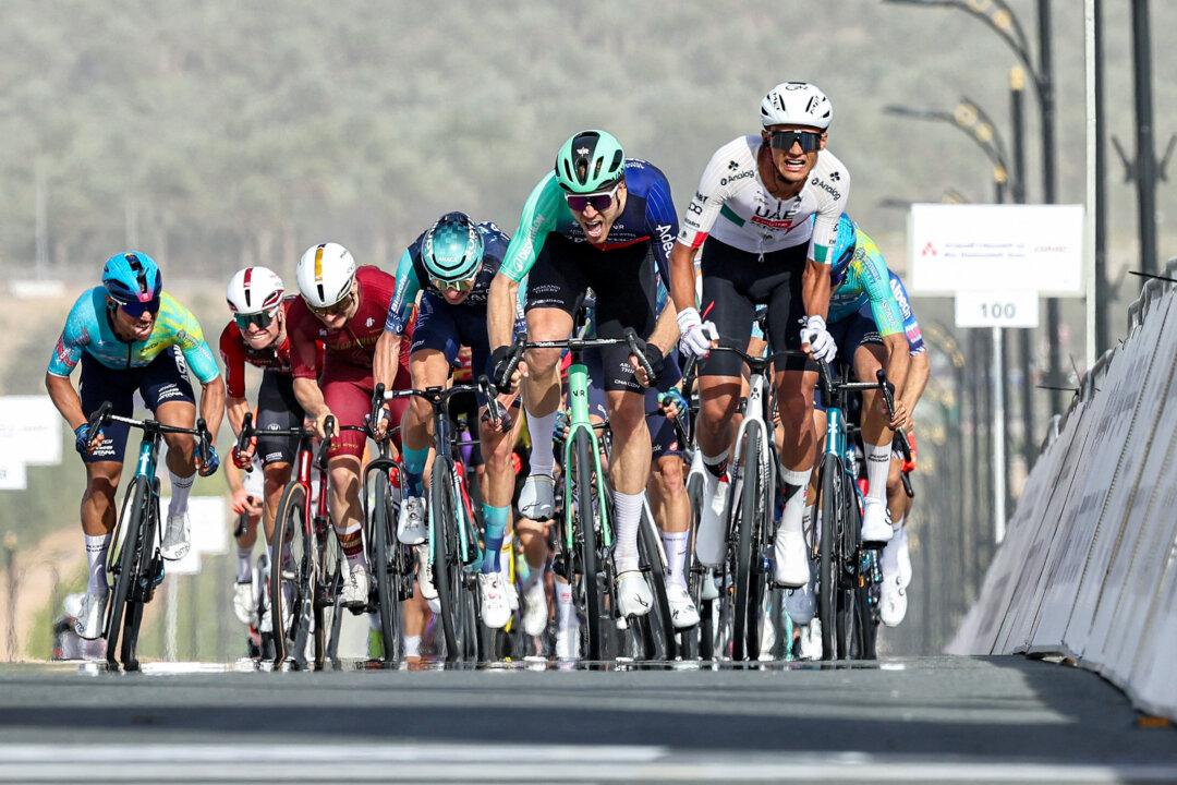 UAE Team Emirates's Mexican rider Isaac Del Toro Romero leads the pack while approaching the finish line during the first stage of the UAE Tour cycling event from Madinat Zayed Majlis to Liwa Palace in Abu Dhabi on February 16, 2026. (Photo by Fadel SENNA / AFP via Getty Images)