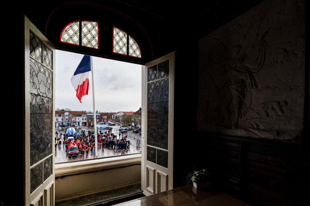 Protesters take part in a rally on the eve of the formal submission of takeover offers for glassmaking giant Arc in Arques, northern France, on February 16, 2026. Around 500 Arc employees and political figures demonstrated in Arques (Pas-de-Calais) on February 16, 2026, on the eve of the deadline for submitting takeover bids for the glassmaker, which was placed in receivership in early January. (Photo by Sameer Al-DOUMY / AFP via Getty Images)