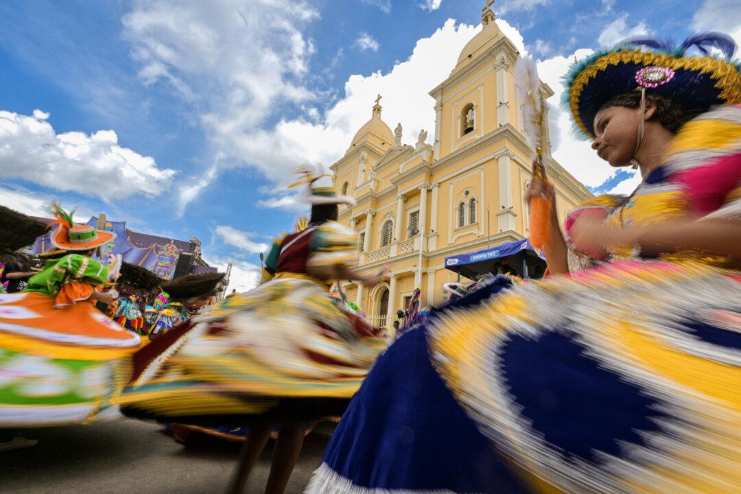NAZARE DA MATA, BRAZIL - FEBRUARY 16: People perform during the 2026 Carnival of Maracatu on February 16, 2026, in Nazaré da Mata, Pernambuco, Brazil. Maracatu is a regional dance and Afro-Brazilian cultural expression, resulting from the cultural mix and African and indigenous influence in the region. Every year, thousands of people participate in the traditional parade. (Photo by Pedro Vilela/Getty Images).