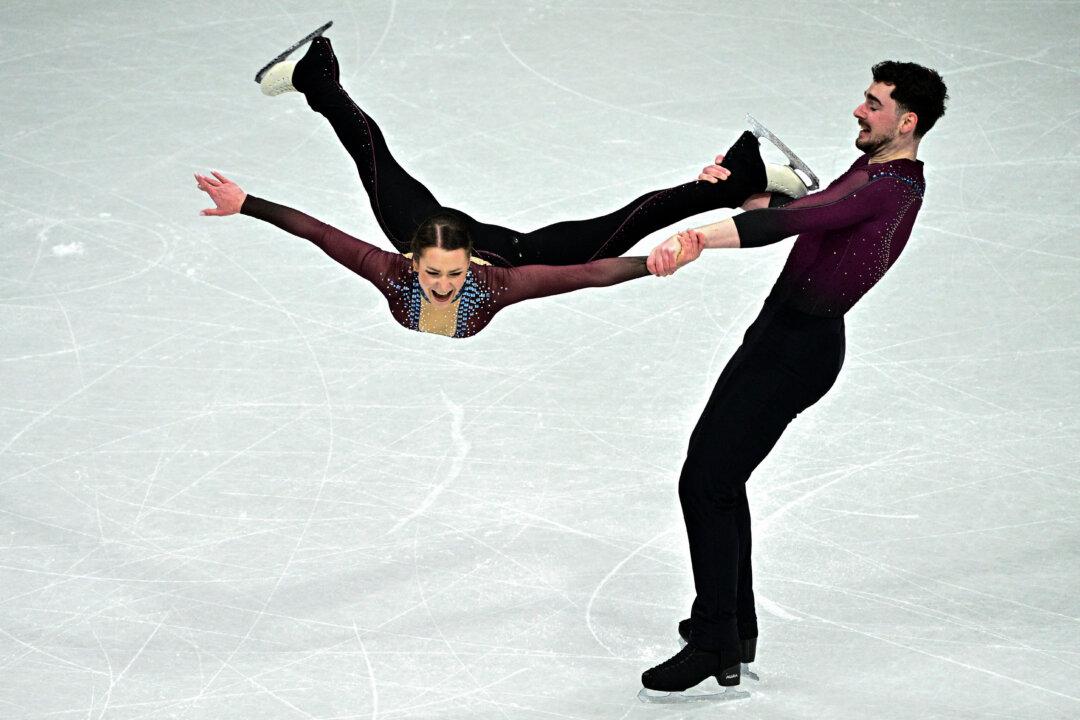 TOPSHOT - Germany's Annika Hocke and Robert Kunkel compete in the figure skating pair skating free skating final during the Milano Cortina 2026 Winter Olympic Games at Milano Ice Skating Arena in Milan on February 16, 2026. (Photo by JULIEN DE ROSA / AFP via Getty Images)
