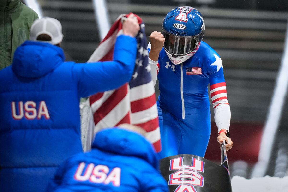 United States' gold medalist Elana Meyers Taylor celebrates at the finish after the women's monobob competition at the 2026 Winter Olympics, in Cortina d'Ampezzo, Italy, on Feb. 16, 2026.(Aijaz Rahi/AP Photo)