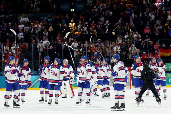 Members of Team United States celebrate after victory in the Men's Preliminary Group C match between the United States and Germany on day nine of the Milano Cortina 2026 Winter Olympic Games at Milano Santagiulia Ice Hockey Arena in Milan, Italy, on Feb. 15, 2026. (Gregory Shamus/Getty Images)