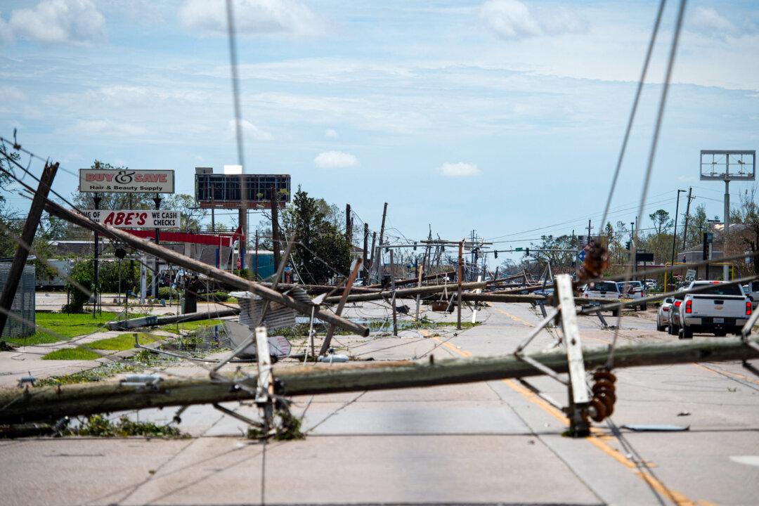Downed power lines block a major road following Hurricane Laura in Lake Charles, La., on Aug. 27, 2020. The storm’s saw-like eyewall sliced into Lake Charles as a Category 4 hurricane, flattening homes and businesses with howling winds and catastrophic storm surge. (Andrew Caballero Reynolds/AFP via Getty Images)