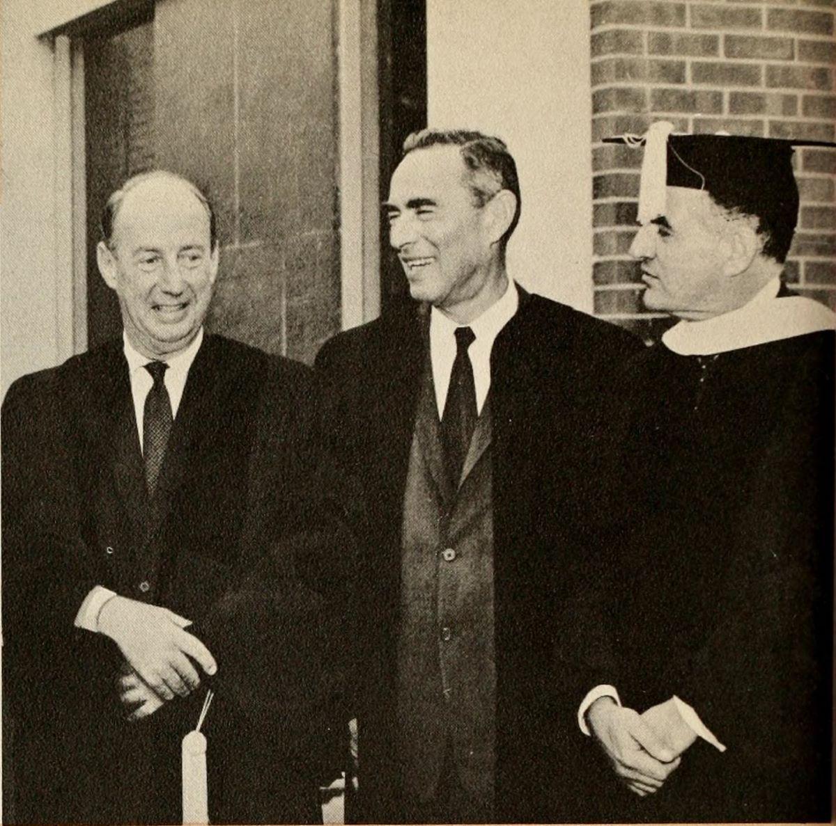 Nelson Glueck (C) is flanked by Ambassador Adlai E. Stevenson (L) and Norman S. Rabb, chairman of the Brandeis University board of trustees at a Brandeis University convocation. (Public Domain)