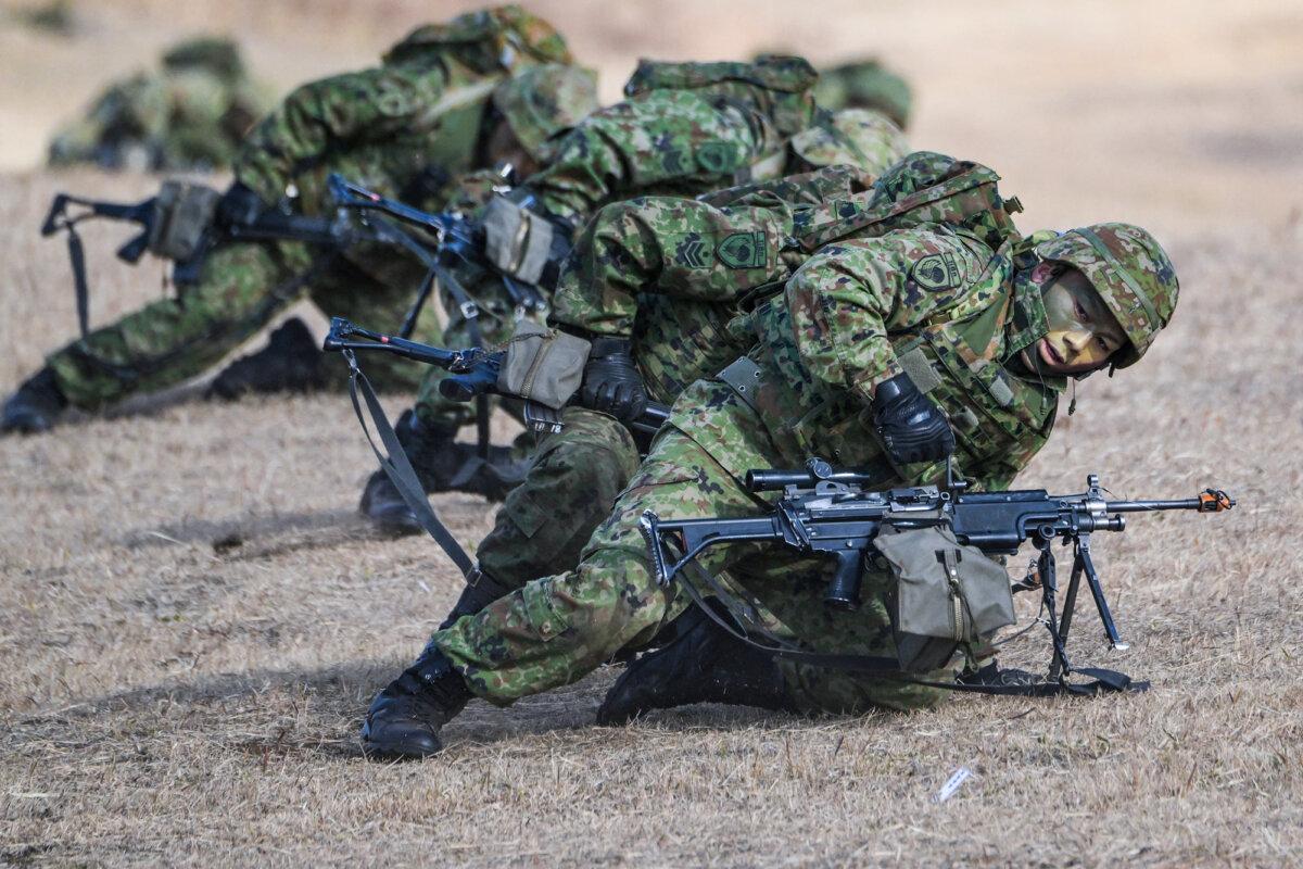 Japanese troops take position during a joint military drill and demonstration with participants from the UK, Canada, Germany, the United States, and others at Camp Narashino in Funabashi, Japan, on Jan. 7, 2024. (Richard A. Brooks/AFP via Getty Images)
