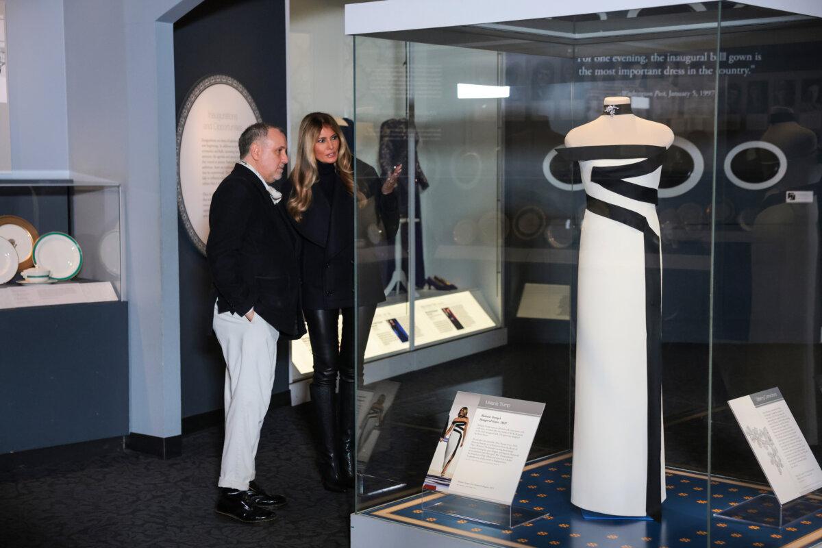 First Lady Melania Trump and fashion designer Hervé Pierre view her second inaugural dress during an event at the Smithsonian National Museum of American History in Washington on Feb. 20, 2026. (Anna Moneymaker/Getty Images)