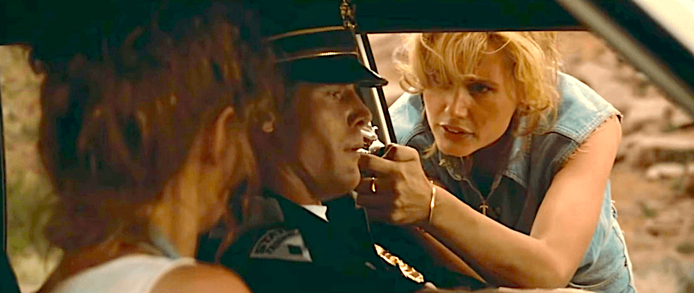 (L–R) Louise (Susan Sarandon), State Trooper (Jason Beghe), and Thelma (Geena Davis). Thelma flips the power dynamic, in “Thelma & Louise.” (MGM)