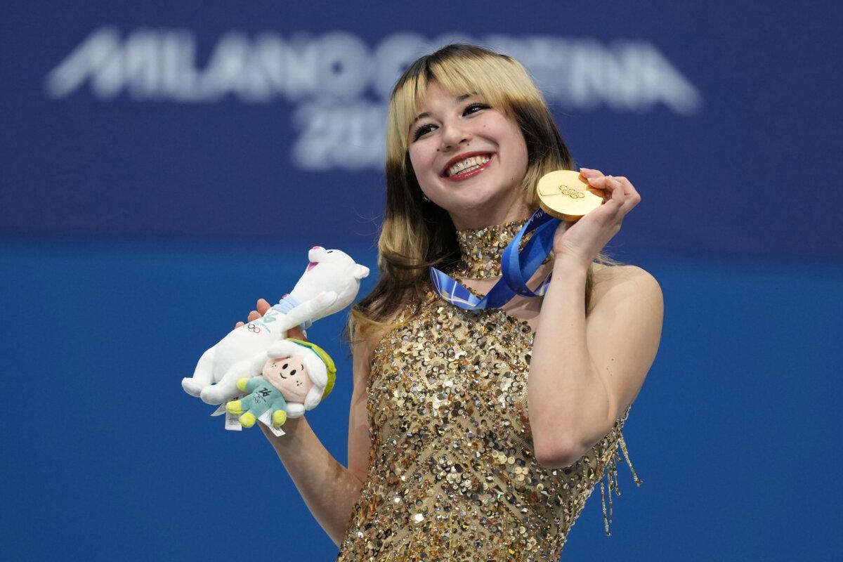Gold medalist Alysa Liu of the United States displays her medal after competing in the women's free skate program in figure skating at the 2026 Winter Olympics in Milan, Italy, on Feb. 19, 2026. (Stephanie Scarbrough/AP Photo)