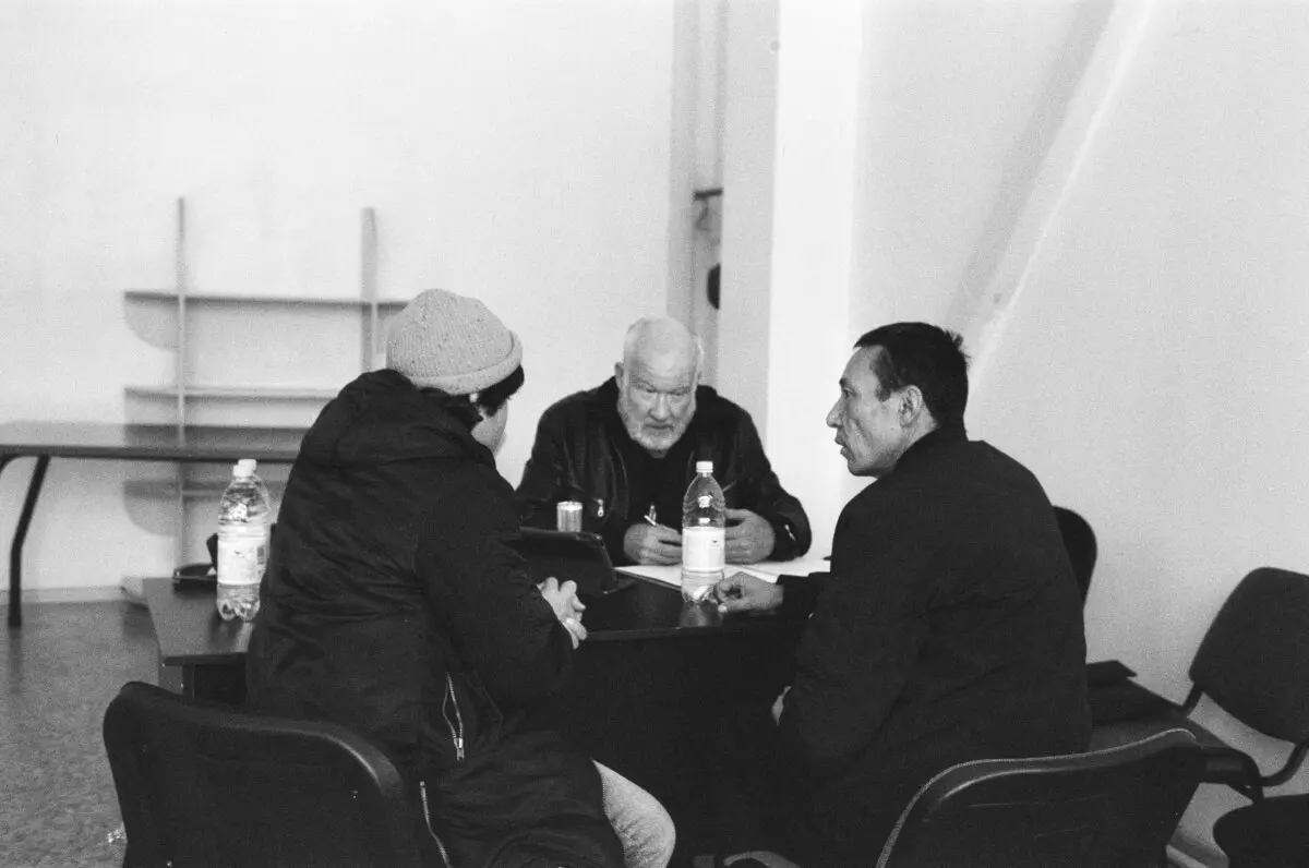 Ethan Gutmann (C) interviewing a Xinjiang refugee in Alamaty, Kazakhstan. (Josephine De Haan)