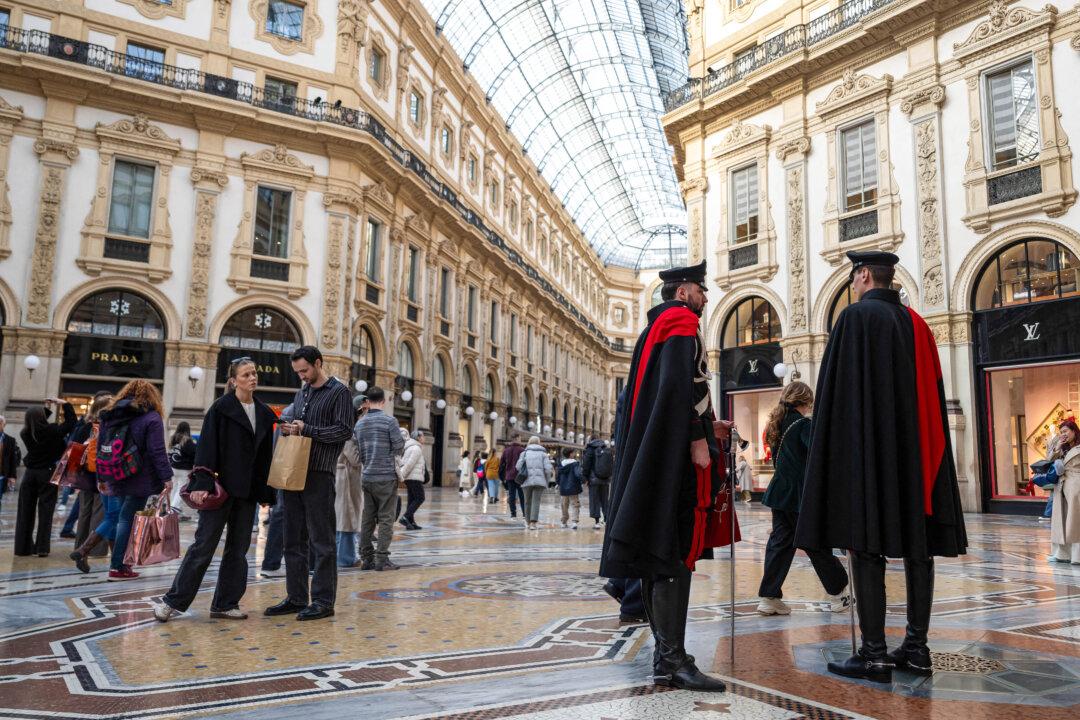 Italian carabinieri in ceremonial uniforms stand in the Vittorio Emanuel II gallery near Duomo square in central Milan on February 23, 2026. (Photo by MIGUEL MEDINA / AFP via Getty Images)