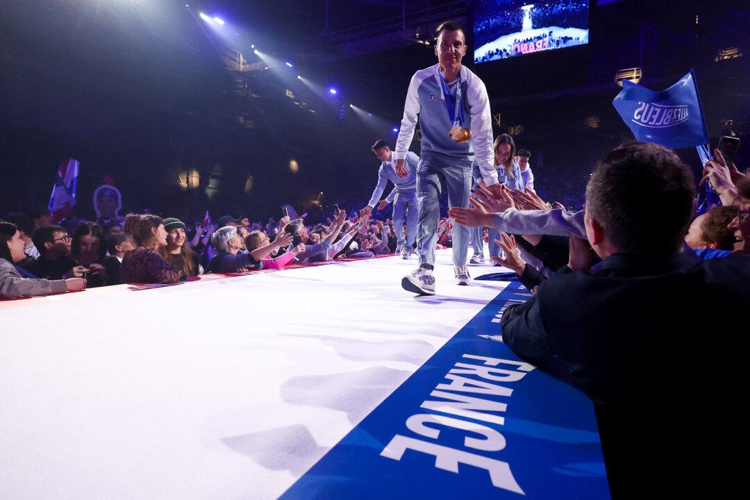 France's most decorated winter Olympian biathlete Quentin Fillon Maillet aknowledges the audience as he takes part in the official celebration of the return of the athletes of the French delegation from the Milano Cortina 2026 Winter Olympic Games in Albertville, south-eastern France on February 23, 2026, as the Olympic flag arrives in the French Alps for the 2030 Olympic Games. (Photo by Alex MARTIN / AFP via Getty Images)