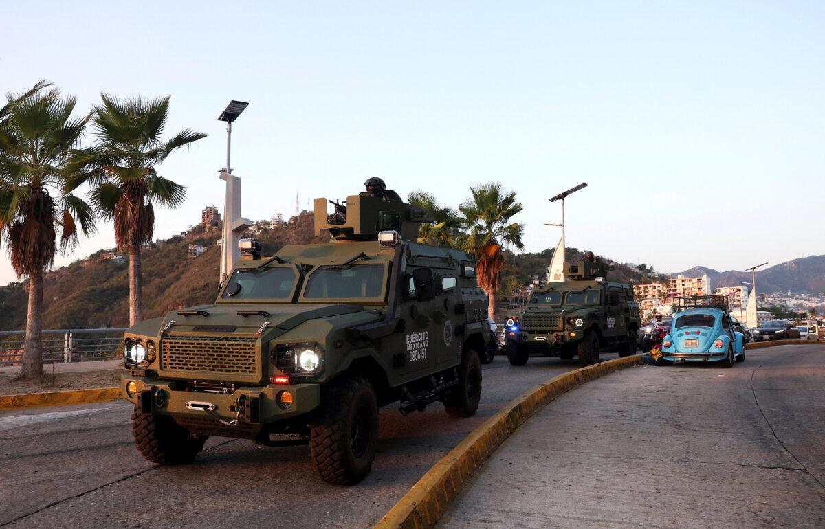 Mexican soldiers patrol in armored vehicles in Acapulco in the aftermath of a military operation in which Mexican drug lord Nemesio Oseguera, known as "El Mencho," was killed in Jalisco state, in Acapulco, Mexico, on Feb. 22, 2026. (Henry Romero/Reuters)