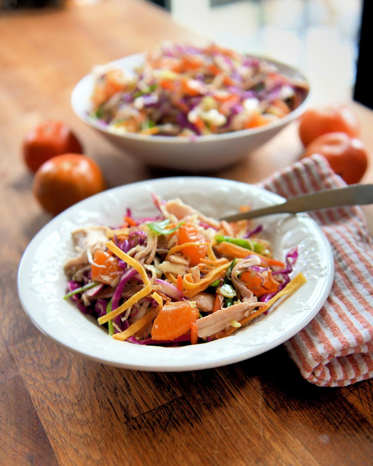 Chinese chicken salad features pulled rotisserie chicken, orange segments, and cabbage in a tangy soy sauce-based dressing.(Gretchen McKay/Post-Gazette/TNS)