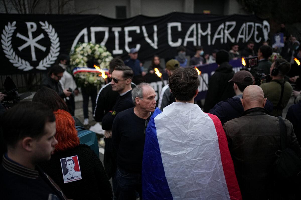 People hold a banner reading "Goodbye comrade" as they take part in a march in Lyon, France, to pay tribute to Quentin Deranque on Feb. 21, 2026. (Laurent Cipriani/AP)