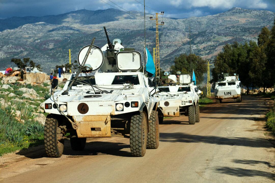 French peacekeepers of the United Nations Interim Force In Lebanon (UNIFIL) patrol at the entrance of the southern Lebanese border village of Sarada on February 24, 2026. Lebanon's army accused the Israeli military on February 24 of firing near a position it was setting up in the country's south, saying it had instructed troops to return fire. (Photo by Rabih DAHER / AFP via Getty Images)