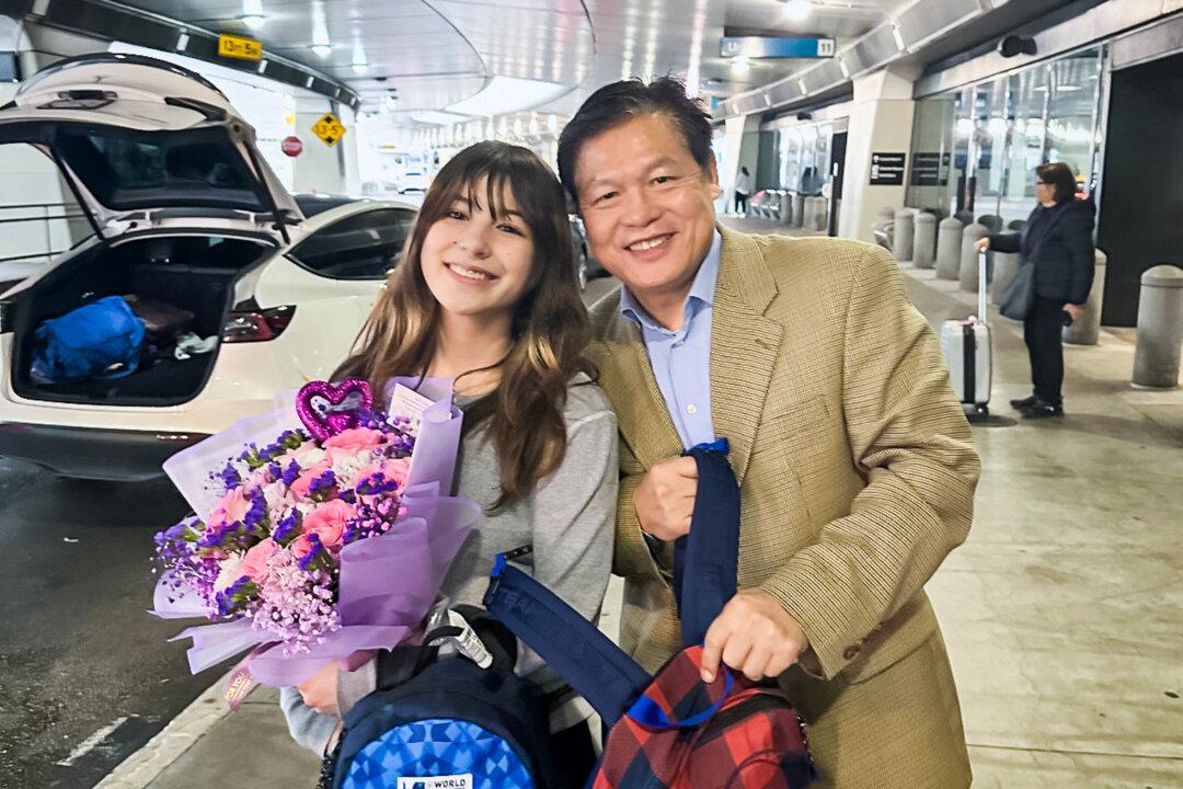 Alysa Liu and her father, Arthur Liu, on her return from the 2025 World Figure Skating Championships in Boston at the San Francisco International Airport in March 2025. Alysa won gold at the competition. (Courtesy of Arthur Liu)