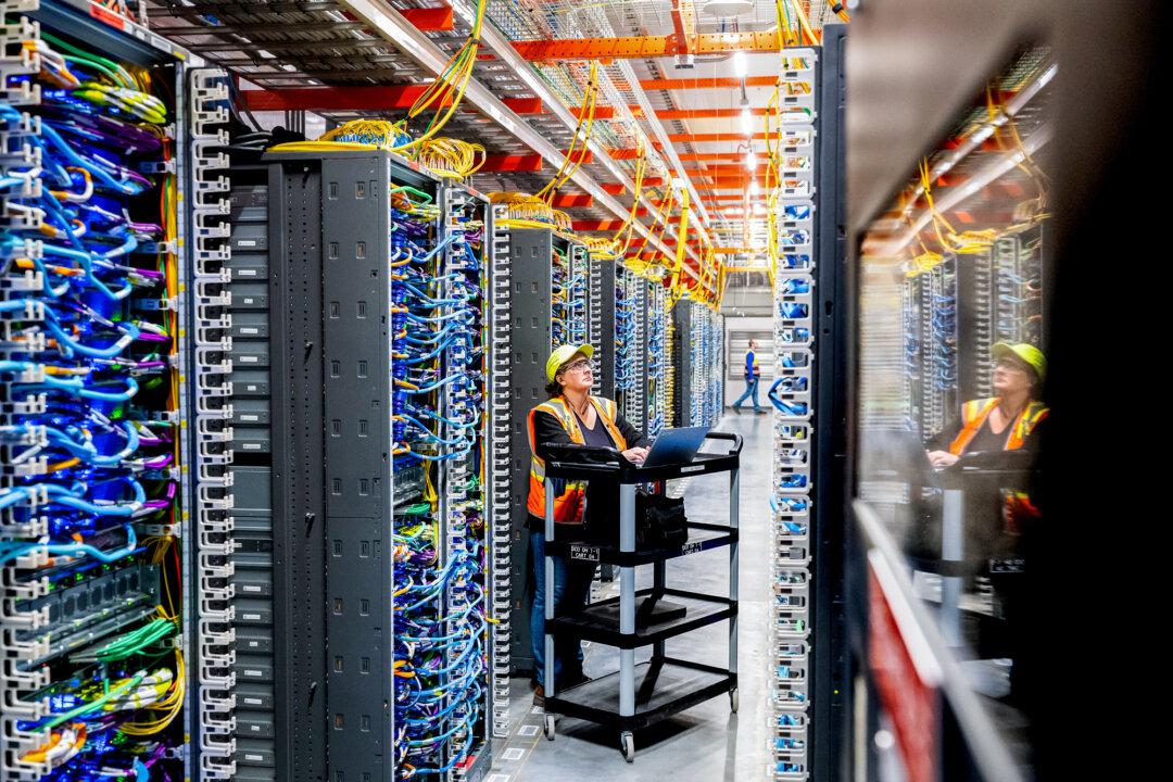 A technician works at an Amazon Web Services AI data center in New Carlisle, Ind., on Oct. 2, 2025. The United States has outpaced many advanced economies in growth and productivity over the past year, with some analysts describing the momentum as the start of a new industrial revolution. (Noah Berger/Getty Images via Amazon Web Services)
