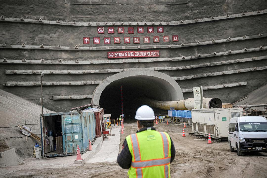 A worker stands near the entrance of a tunnel at the site where Chinese company Cosco Shipping is building a port in Chancay, some 48 miles north of Lima, Peru, on Aug. 22, 2023. (Ernesto Benavides/AFP via Getty Images)