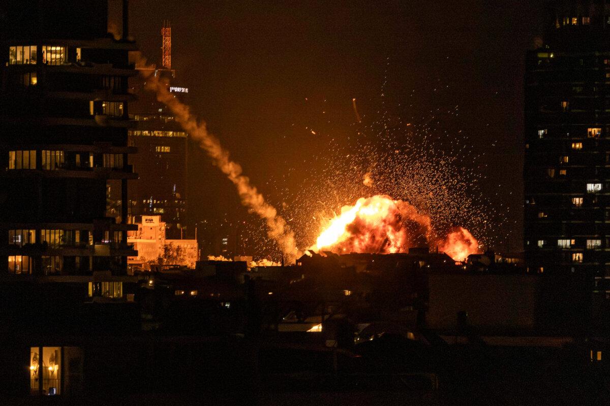 A fireball lights the sky following a missile strike on Tel Aviv, in Tel Aviv, Israel, on Feb. 28, 2026. (John Wessels / AFP via Getty Images)