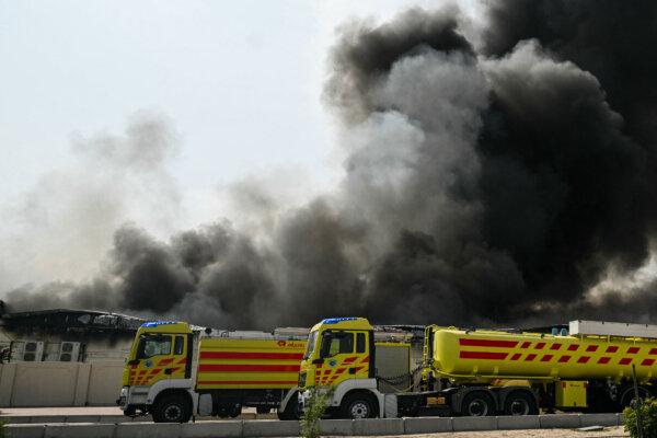 A plume of smoke rises from a reported Iranian strike in the industrial district of Doha, Qatar, on March 1, 2026. (Mahmud HAMS / AFP via Getty Images)