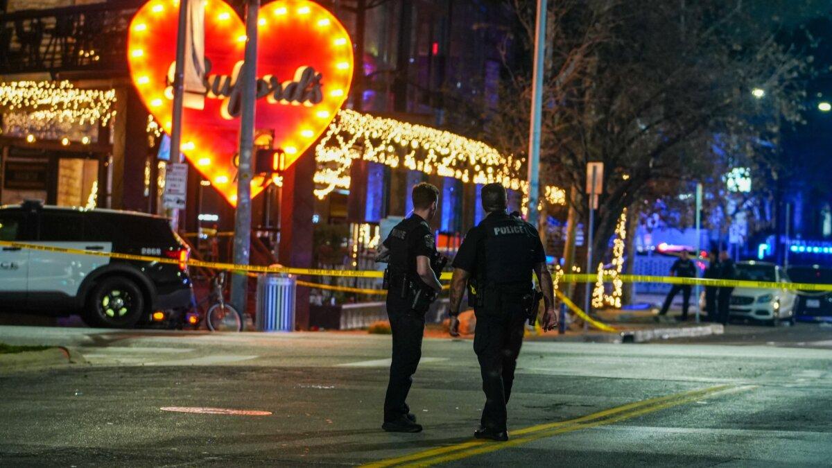 Police officers guard the scene on West Sixth Street at West Avenue after a shooting in Austin, Texas, on March 1, 2026. (Ricardo B. Brazziell/Austin American-Statesman via AP)