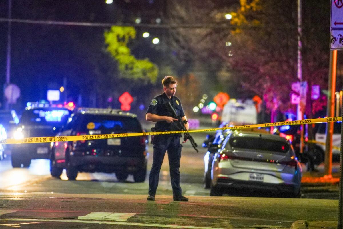 An Austin police officer guards the scene on West 6th Street at West Avenue after a shooting in Austin, Texas, on March 1, 2026. (Ricardo B. Brazziell/Austin American-Statesman via AP)