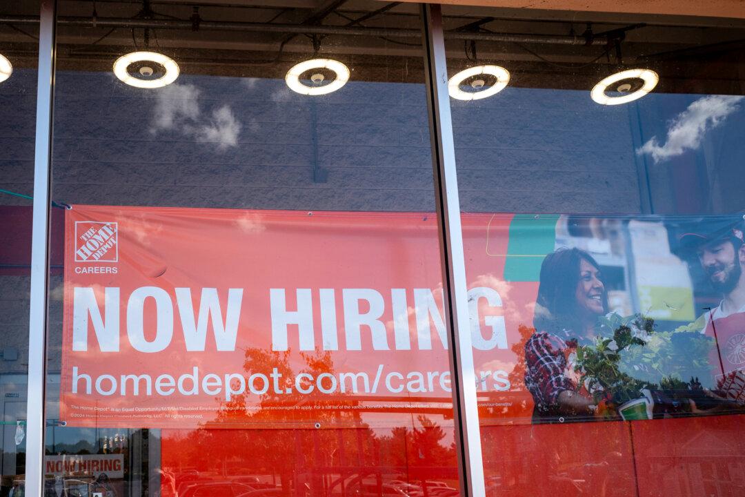 A hiring ad is displayed at a store in Columbia, Md., on Sept. 18, 2025. Experts say job seekers must optimize their resumes for relevant skills to pass automated screening systems and reach employers. (Madalina Kilroy/The Epoch Times)